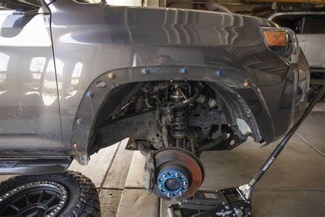 A truck fender removed and prepared for trimming, a crucial step in learning how to trim truck fenders like a pro.