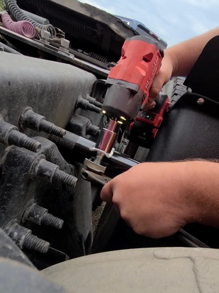 a person installing Quarter Fenders